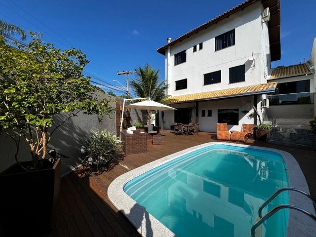 Foto 1 de Casa 3 suítes + 1 dorm à venda · Ariribá, Balneário Camboriú